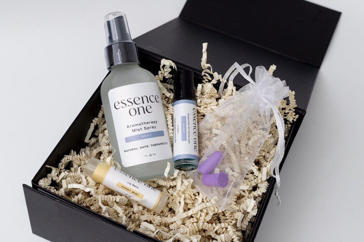 Essence One sleep gift set with pillow mist, sleep rollerball, lip balm, and ear plugs